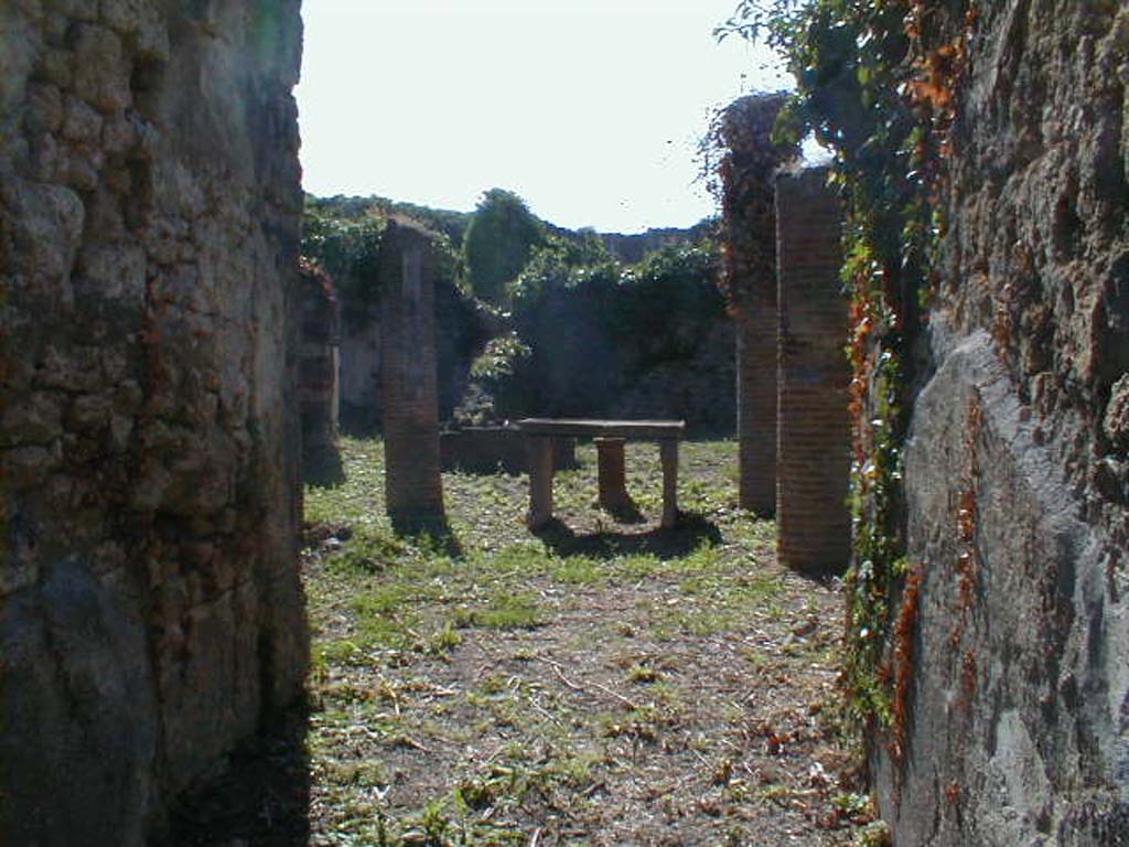 VI.15.6 Pompeii. September 2004. Looking west across atrium, from entrance fauces.  
According to NdS, two bronze signet/seals were dug up in the atrium.
One had the name A. Caesi Valentis, and on the other was N. Herenni Nardi.
See Notizie degli Scavi di Antichità, January 1897, (p.30)

