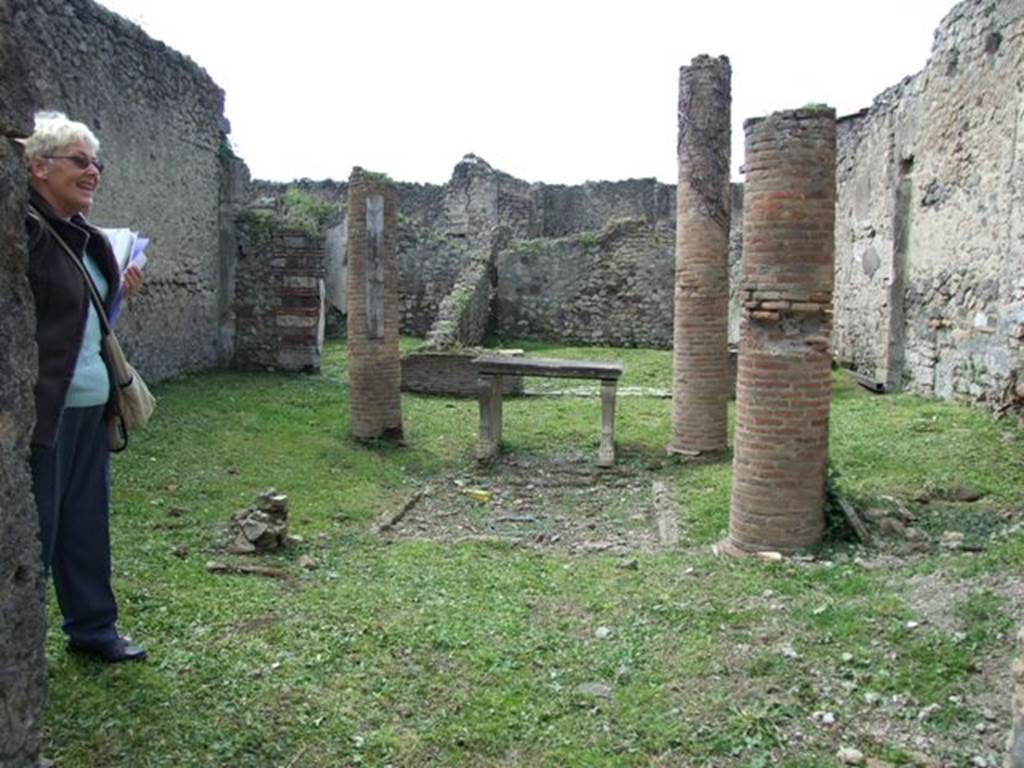 VI.15.6 Pompeii. March 2009. Room 1, atrium. Looking west from entrances fauces.
According to NdS, the four columns that held up the corners of the impluvium roofing were brick and devoid of any decoration. The walls of the atrium were also without decoration.
In the north-east corner of the atrium was the beginning of a staircase to the upper floor. 
