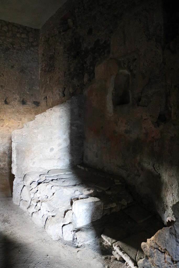 VI.15.8 Pompeii. December 2018. 
Looking towards north-west corner of kitchen with hearth, and niche above in north wall.
Photo courtesy of Aude Durand.
