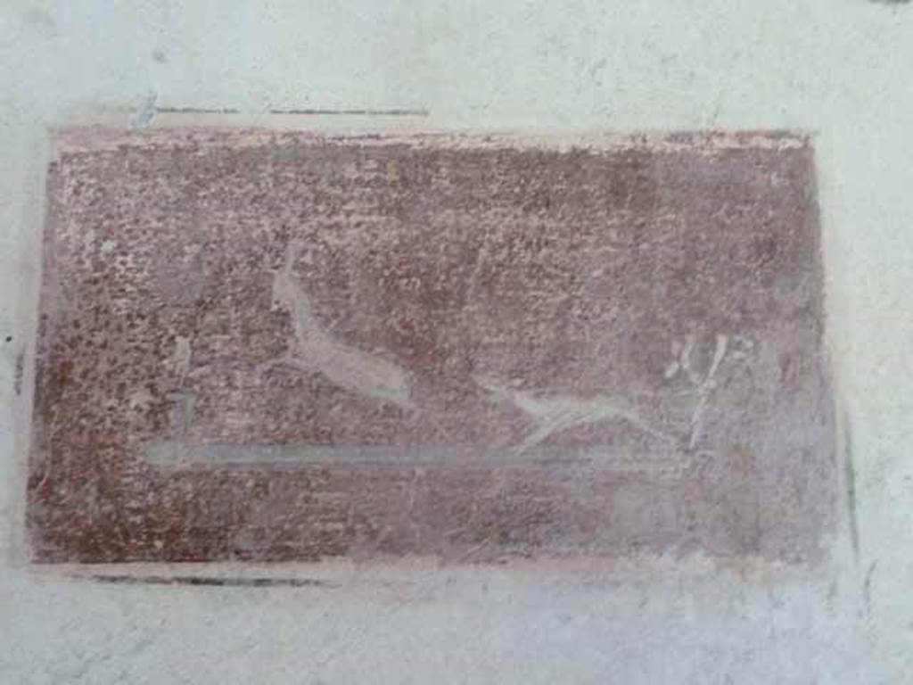 VI.15.8 Pompeii. May 2010. Painted panel of hunting scene on north wall of tablinum.