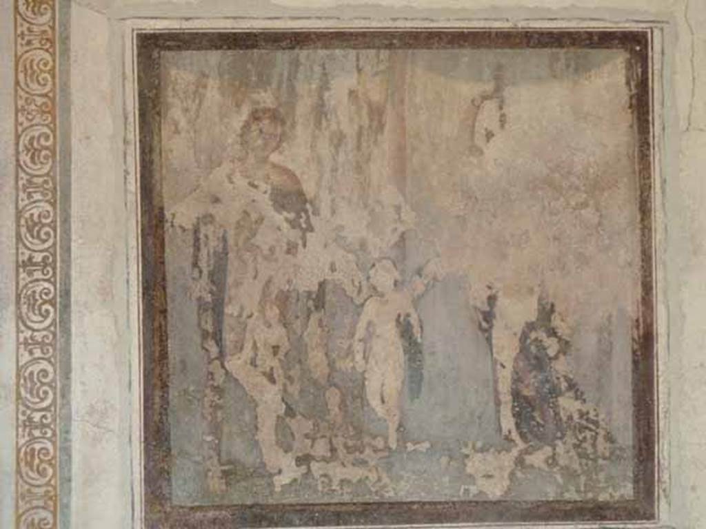 VI.15.8 Pompeii. May 2010. Remains of fresco of Paris, Eros and Helen on east wall of Oecus.