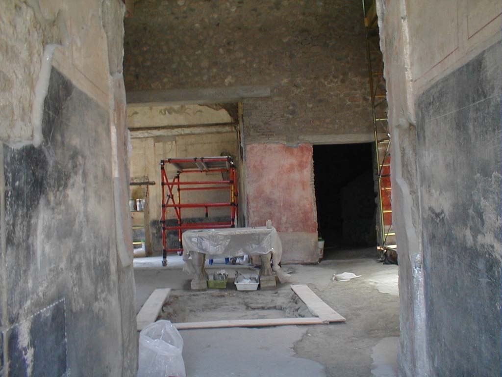 VI.15.8 Pompeii. May 2005. Looking west across atrium under renovation, from entrance corridor.