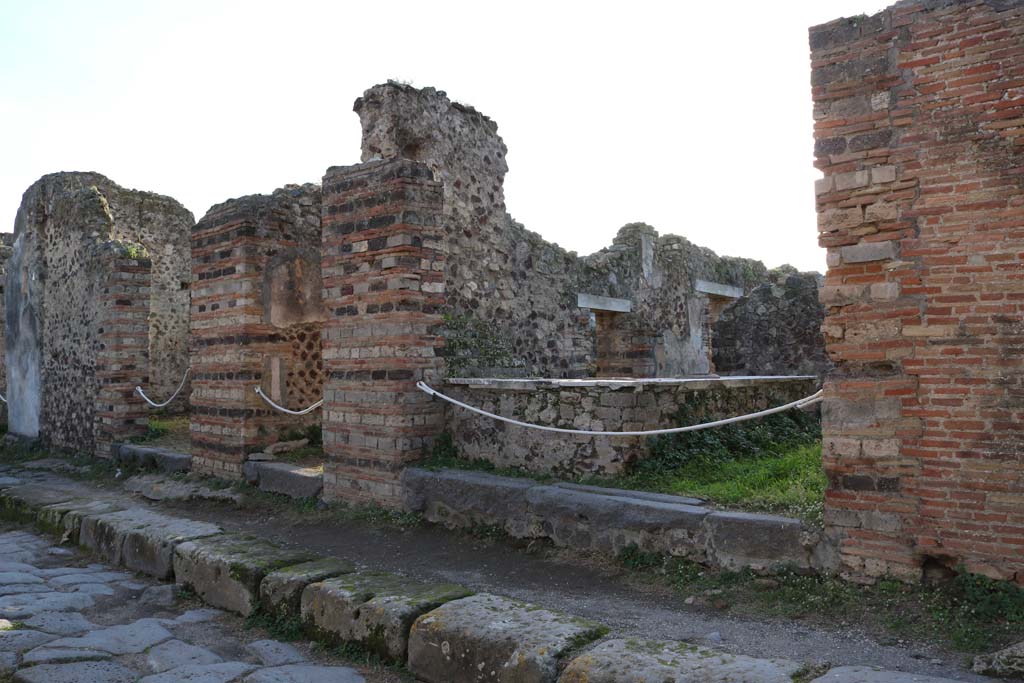 VI.15.13 Pompeii, on left. December 2018. Looking south-east towards entrances on Vicolo dei Vettii. Photo courtesy of Aude Durand.