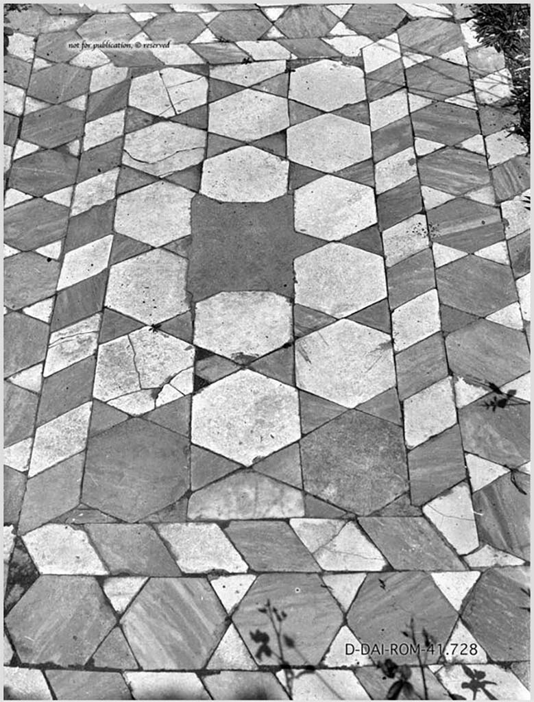 VI.15.14 Pompeii. c.1930. 
Tablinum flooring with site of a central emblema, and showing stars formed by bardiglio (grey) hexagons and palombino (white) triangles of marble.
See Blake, M., (1930). The pavements of the Roman Buildings of the Republic and Early Empire. Rome, MAAR, 8, (p.42 & Pl.7, tav.2).
