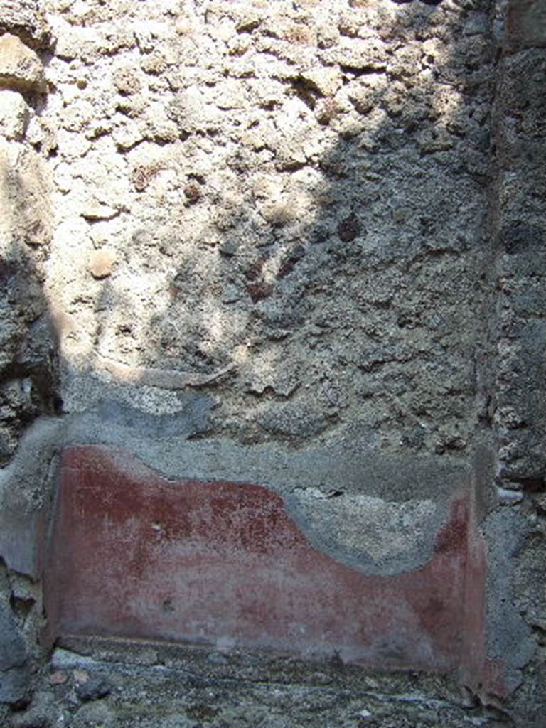 VI.15.20 Pompeii. September 2005. Remains of painted wall decoration.