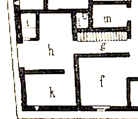 VI.15.1 Pompeii. South-east corner with entrance at VI.15.27 on left. 
Corridor g – from south side of atrium.
Room (shop) h – which acted as posticum to the house, with entrance at VI.15.27.
Latrine - i.
Stable – k.
Well - l (L).
See Sogliano, A. La Casa dei Vettii in Mon. Ant. 1898, (p.233-4, part of Fig.1)
