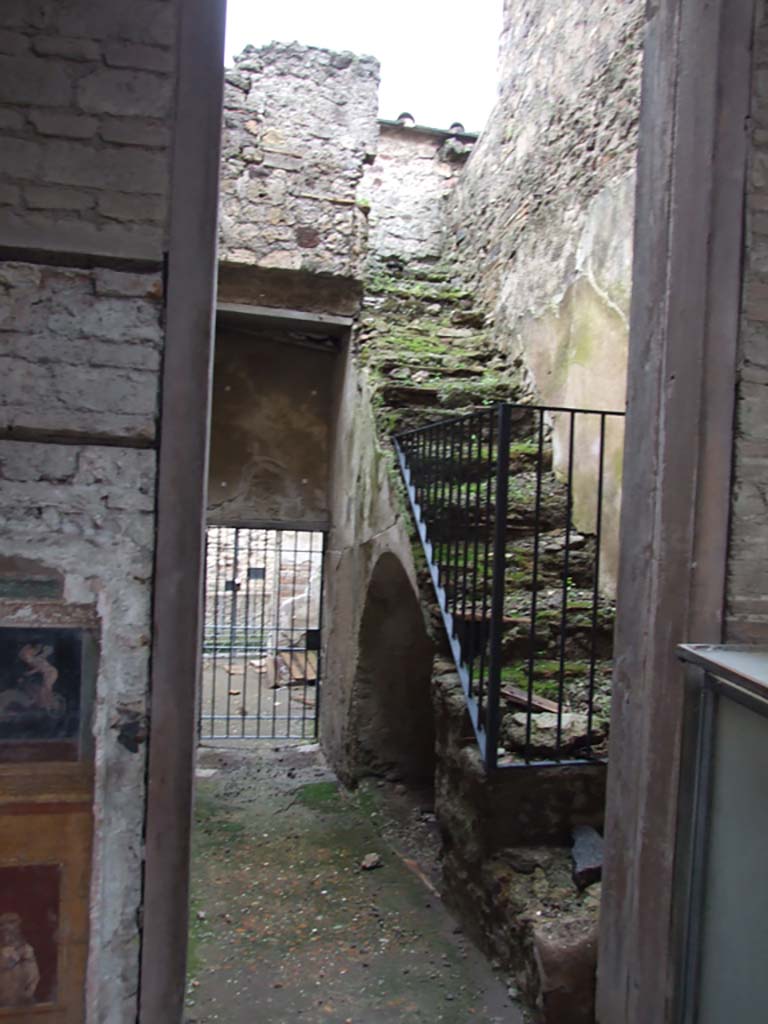 VI.15.27 Pompeii. December 2006.  
Looking south from atrium of VI.15.1, towards room with steps to upper floor and corridor leading to stable entrance at VI.15.27.
