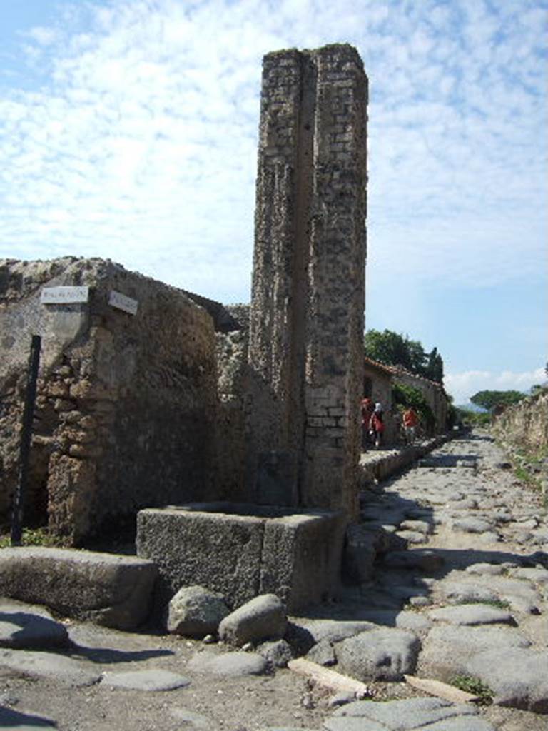 Via del Vesuvio, Pompeii. Looking north from fountain and water column between VI.16.3 and VI.16.4