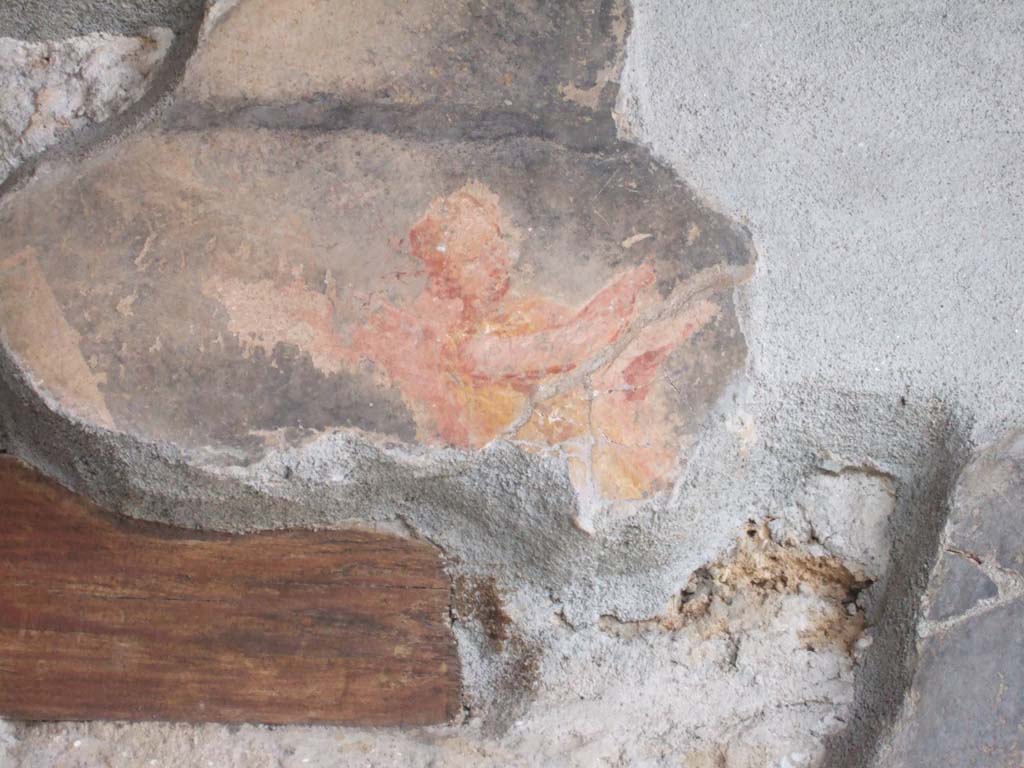 VI.16.7 Pompeii. May 2006. West wall of room F, west portico. Painted figure above doorway to room Q.