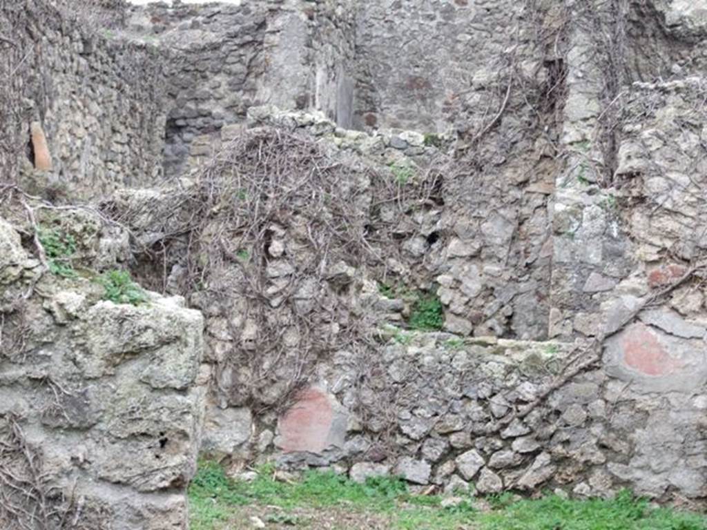 VI.16.11 Pompeii. December 2007. Room in north-west corner of shop, west wall with window and remains of red dado.