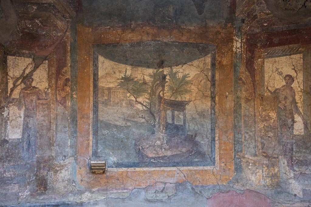 VI.16.15 Pompeii. 2015/2016. 
Painted pilaster on west side of atrium B with doorway to room C, on left. 
Photo courtesy of Giuseppe Ciaramella.

