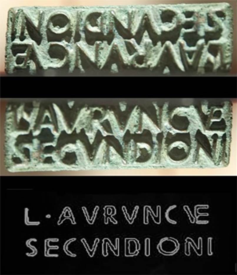 VI.16.32/33 Pompeii. Found 14th June 1904. Bronze sigillo or stamp of L. Aurunculeius Secundio. 
Top is the face of the seal. 
Centre is the reversed image.
Bottom is a drawing showing the outline of the stamp produced by the seal.
Composite photo courtesy of Dan Pater. SAP inventory number 55814. 