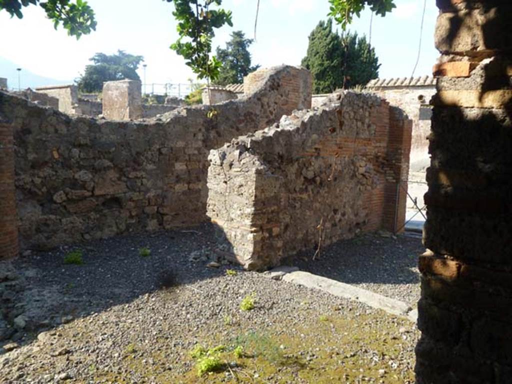 VI.17.5 Pompeii. May 2011. Looking north-east from atrium towards entrance corridor, centre, and wide opening linking with the shop at VI.17.6, on right.