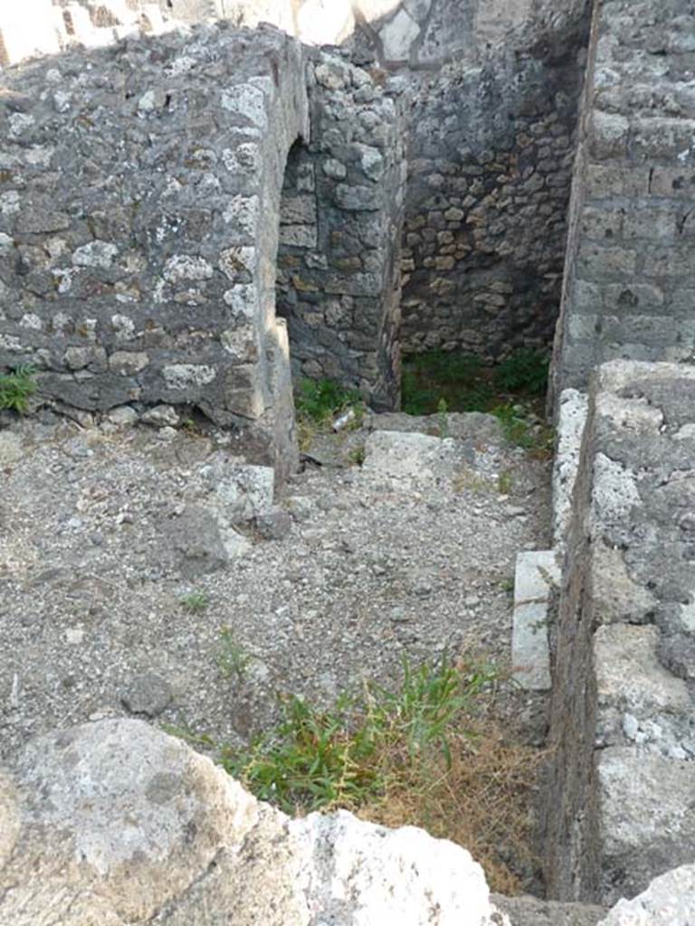 VI.17.10 Pompeii. September 2015. Looking south from entrance towards stairs to lower floor, (see VI.17.11).  The doorway on right, would lead to the south-east corner of the atrium. 

