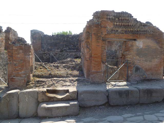 VI.17.36-35 Pompeii. May 2011. Looking west to entrance doorways on Via Consolare. 
Photo courtesy of Michael Binns.
