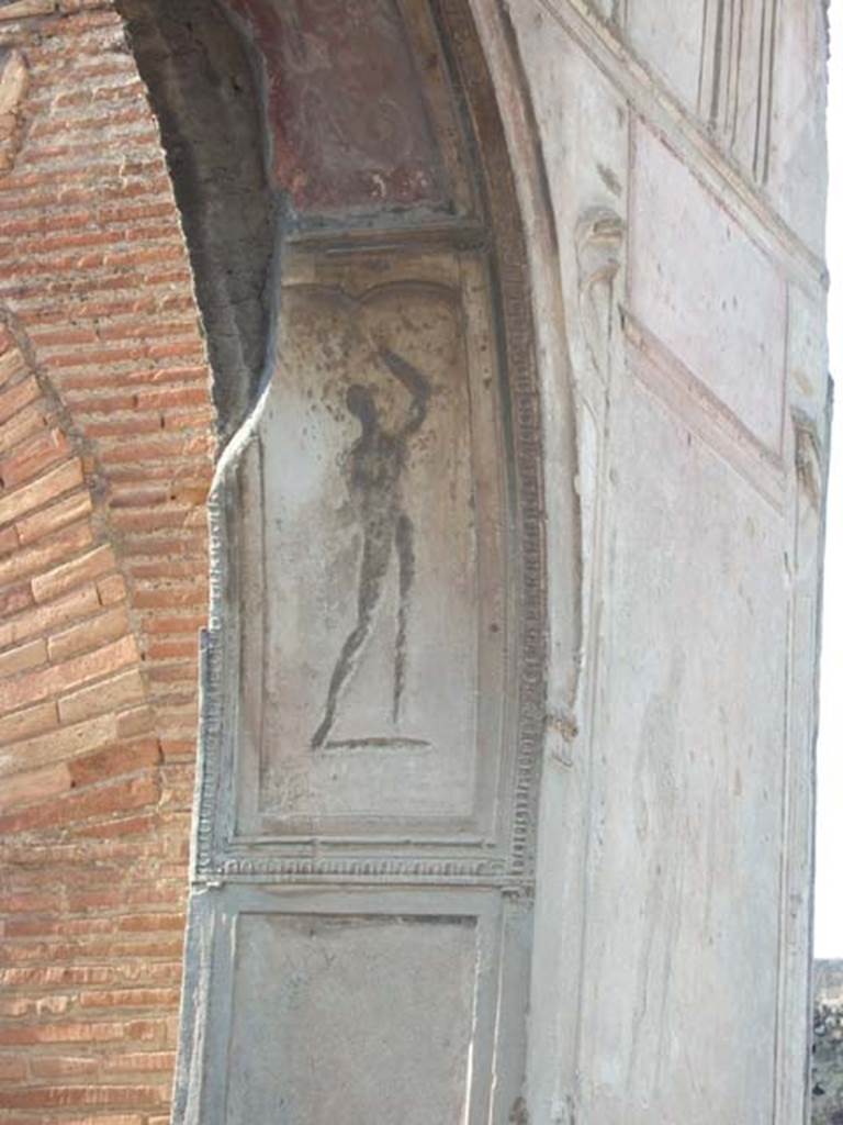 VII.1.8 Pompeii. September 2005. Nymphaeum F, east wall. 
Decorative stucco plasterwork figure on north side of arch.  
