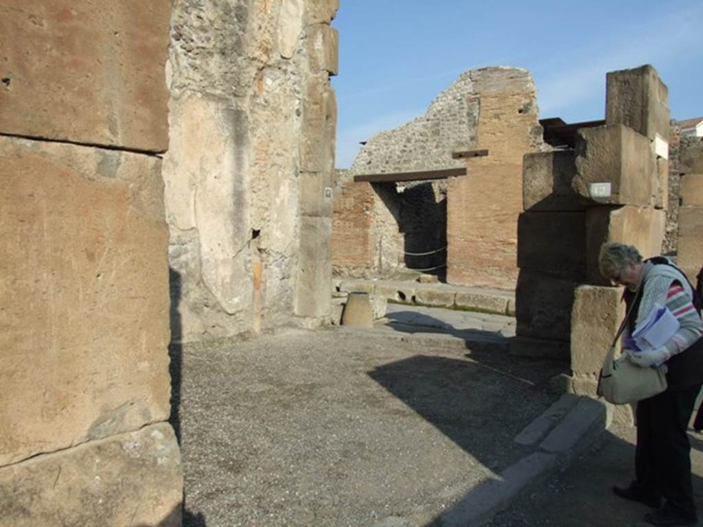 VII.1.12 Pompeii. December 2007. Entrance on Via dellAbbondanza. 
Looking east towards VII.1.13 entrance on Via Stabiana. For graffiti, found in August 1853, between VII.1.11 and 12, pilaster on the left, see VII.1.11.

