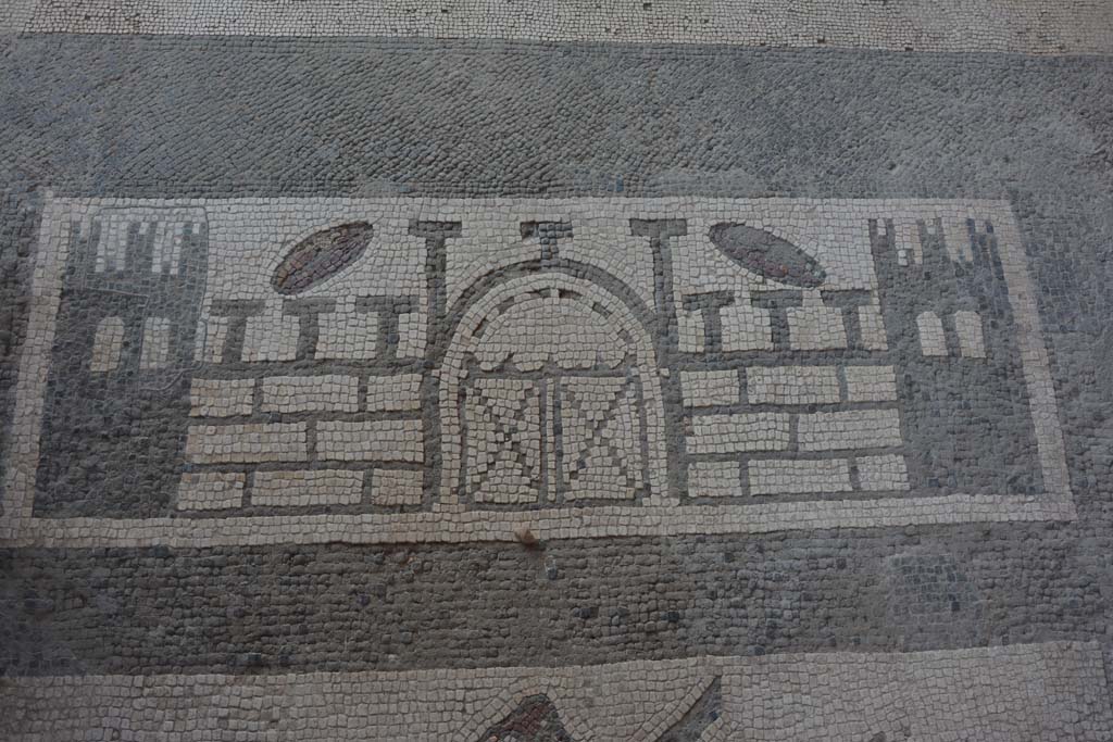 VII.1.40 Pompeii. September 2005. Mosaic in entrance corridor of dolphins, trident, sea-monster and ship’s helm.