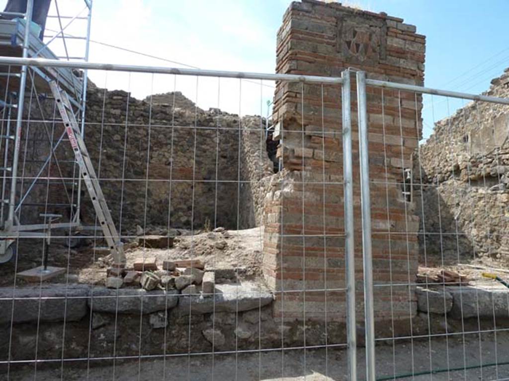 VII.2.1 Pompeii. September 2015. Looking towards north side of shop, towards the wall that collapsed, but now being reconsolidated. 