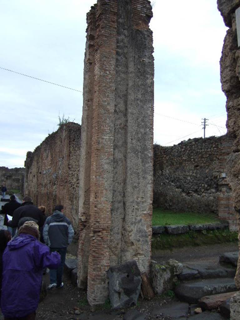 Pompeii. December 2005. Water tower at VII.2.1, looking west along Via degli Augustali.