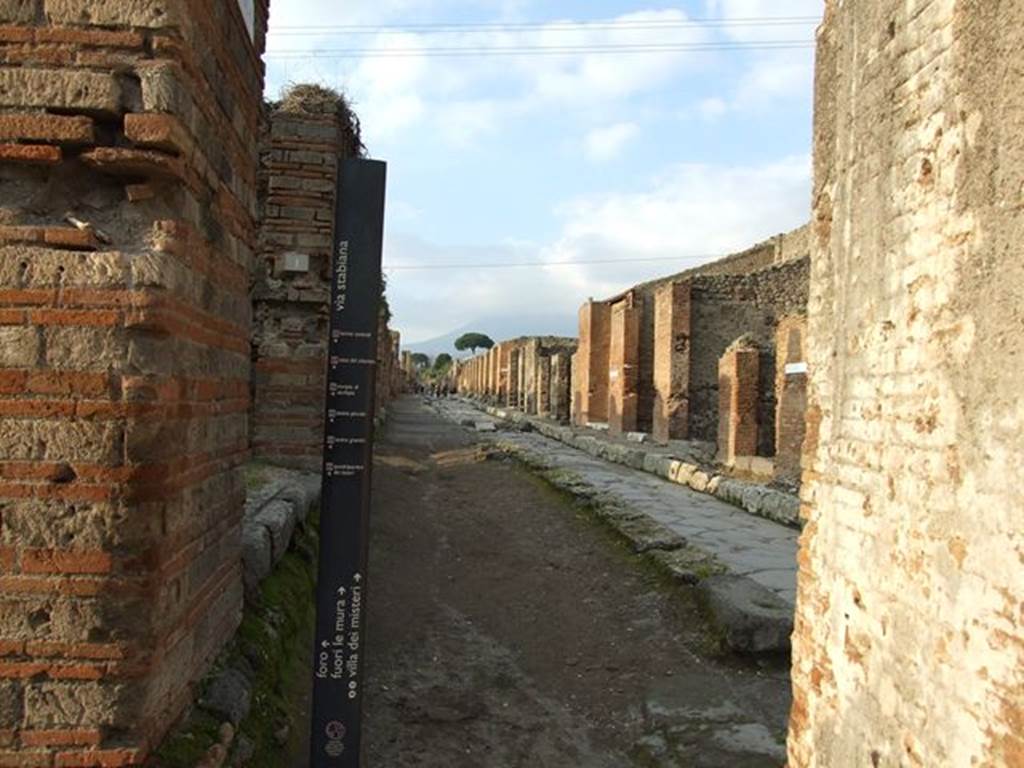Pompeii. March 2009. Looking north on Via Stabiana outside VII.2.1 with wall of water tower on right.