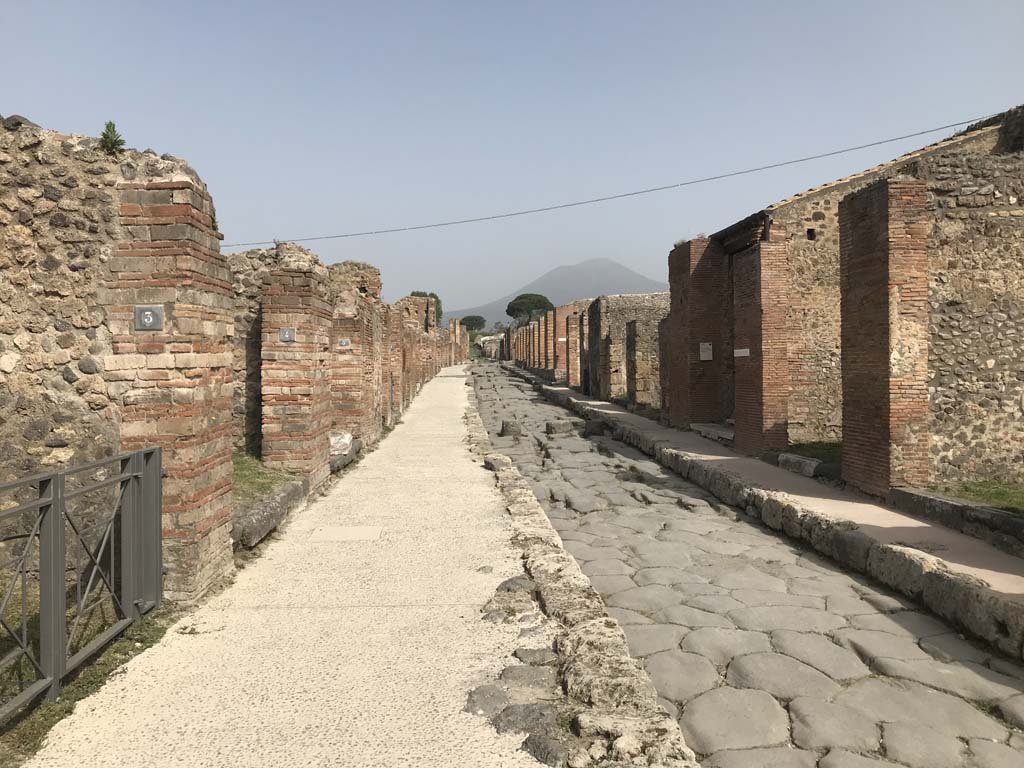 VII.2.3, on left, Pompeii. April 2019. Looking north along Via Stabiana, from VII.2.3 entrance doorway. 
Photo courtesy of Rick Bauer.
