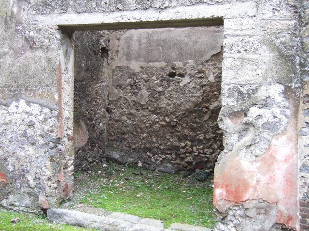 VII.2.17 Pompeii. December 2005. Entrance on Vicolo del Panettiere, looking south. According to Varone, found on the wall between VII.2.16 and VII.2.17 (on the left), was the inscription
Vesbinus  cinedus,  Vitalio  pedicavit     [CIL IV 2319b]

Found on the right of the doorway, between VII.2.17 and 18, was
Serena 
Isidoru
fastidit     [CIL IV 3117]
Varone translates this as Serena cant stand Isidorus.  He also mentions that Isidoru is written for Isidorum.

See Varone, A., 2002. Erotica Pompeiana: Love Inscriptions on the Walls of Pompeii, Rome: Lerma di Bretschneider. (p. 137 and p.50)
