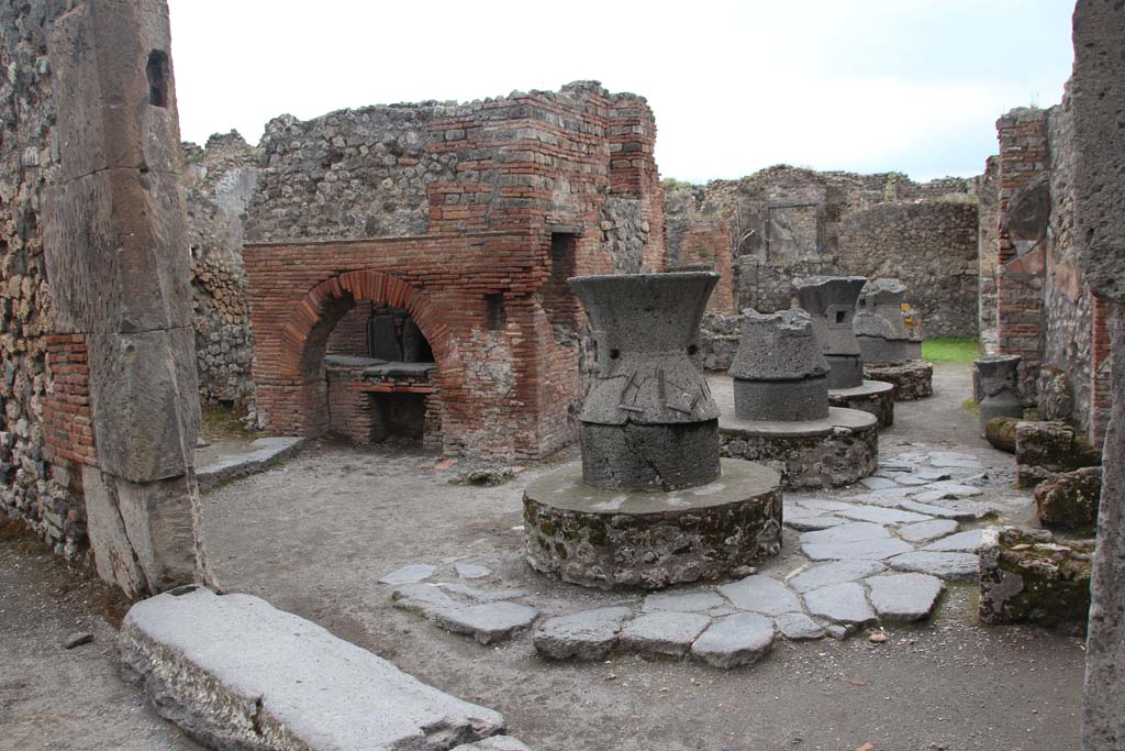 VII.2.22 Pompeii. April 2019. Looking east towards oven and mills. 
Photo courtesy of Rick Bauer.
