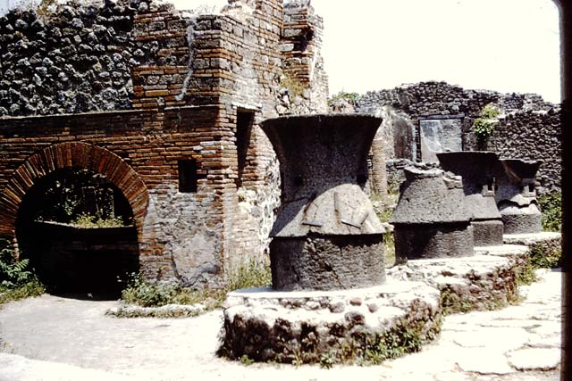 VII.2.22 Pompeii. 1950’s. Looking towards oven and mills in bakery. Photo courtesy of Rick Bauer.
