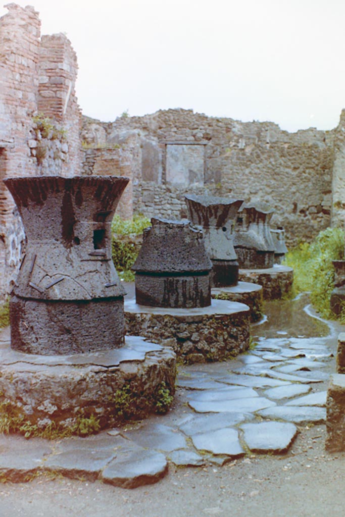 VII.2.22 Pompeii. August 1965. Four mills in bakery. Photo courtesy of Rick Bauer.