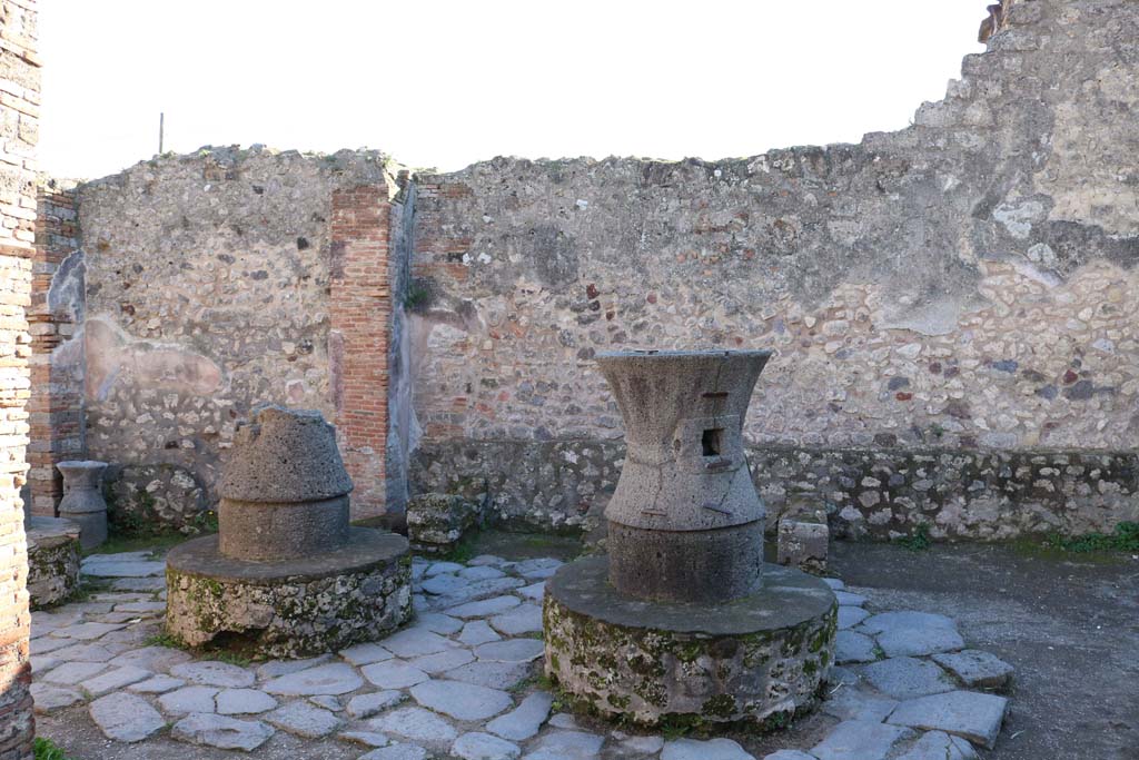 VII.2.22, Pompeii. December 2018. Looking across mills towards south wall of bakery. Photo courtesy of Aude Durand.