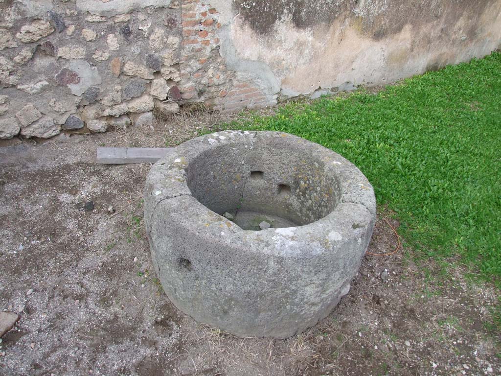 VII.2.22 Pompeii. December 2006. Circular stone with holes.