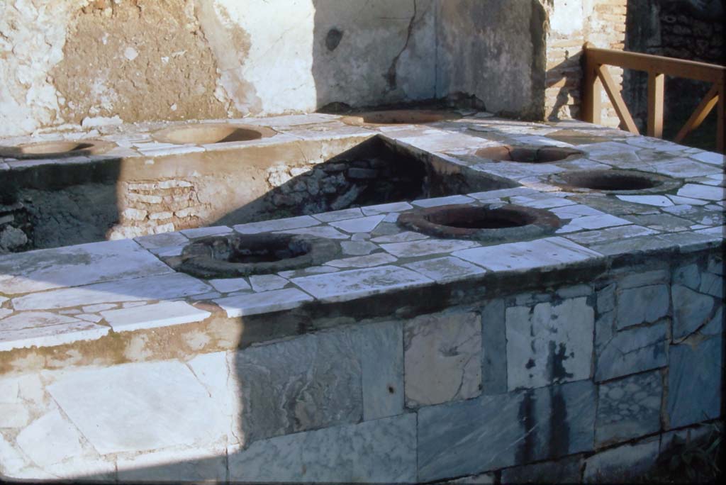 VII.2.32 Pompeii. 4th December 1971. Looking east across marble clad counter.
Photo courtesy of Rick Bauer, from Dr.George Fay’s slides collection.

