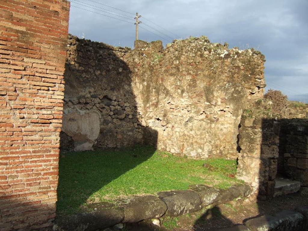 VII.2.34 Pompeii. December 2005. East wall and entrance to shop.