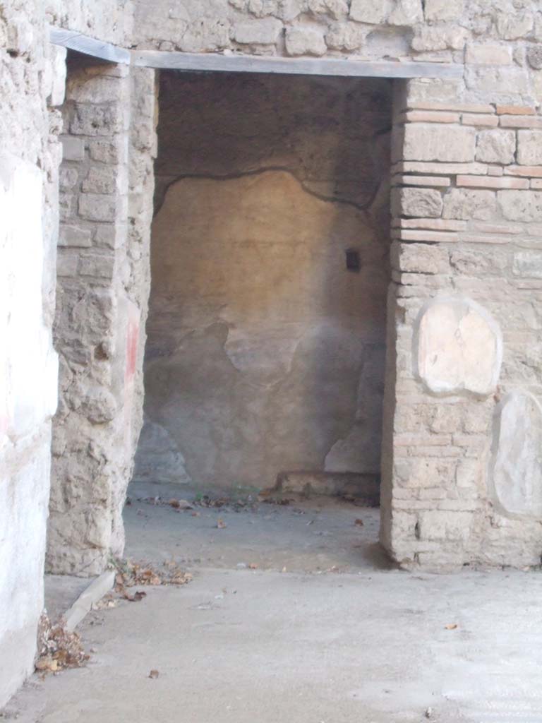 VII.2.45 Pompeii. September 2005. Ahead is the doorway to room on north side of atrium. 
To the left is the doorway to the room with the stairs on the west side of the atrium.
