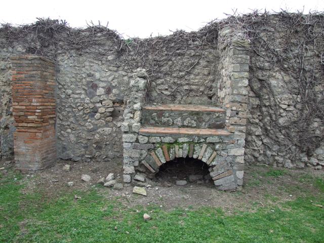 VII.3.9 Pompeii. December 2007. Hearth or oven on west wall.