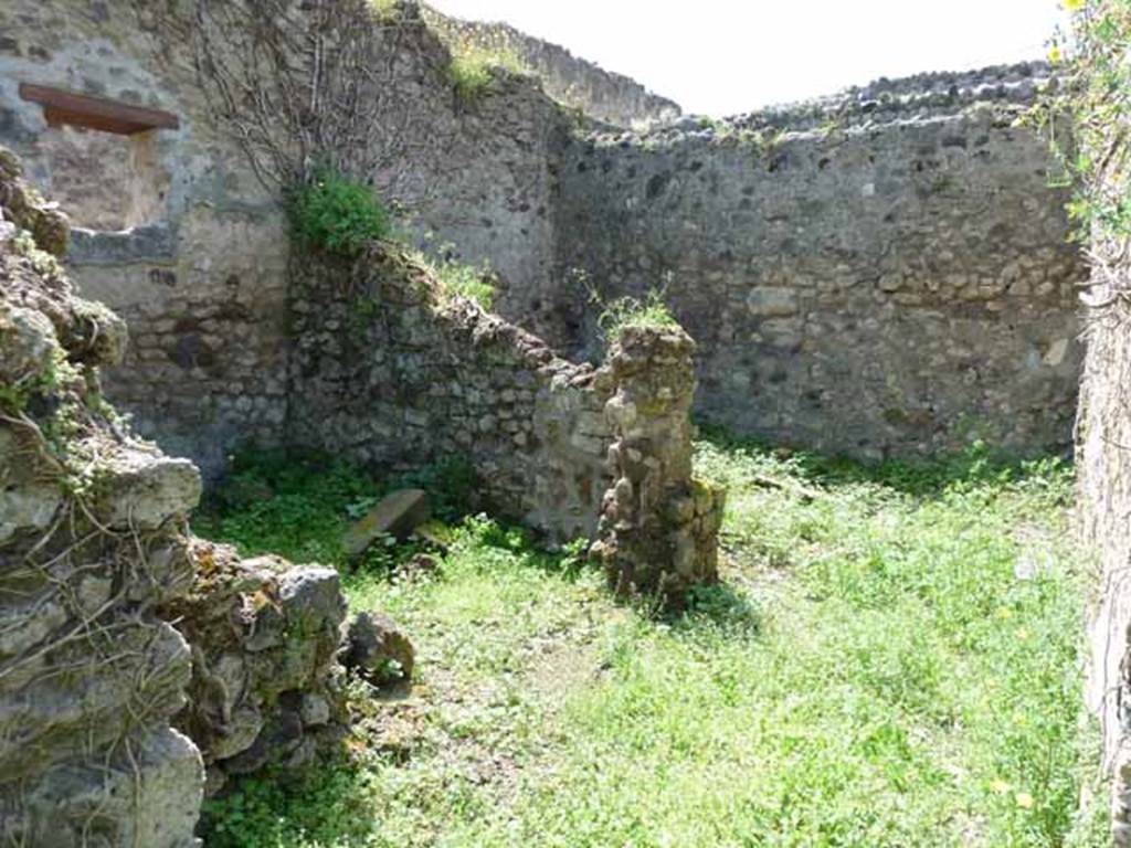 VII.3.23 Pompeii. May 2010. Rear of the house in the south-west corner. On the left was the triclinium, with a window to the garden area, on the right.