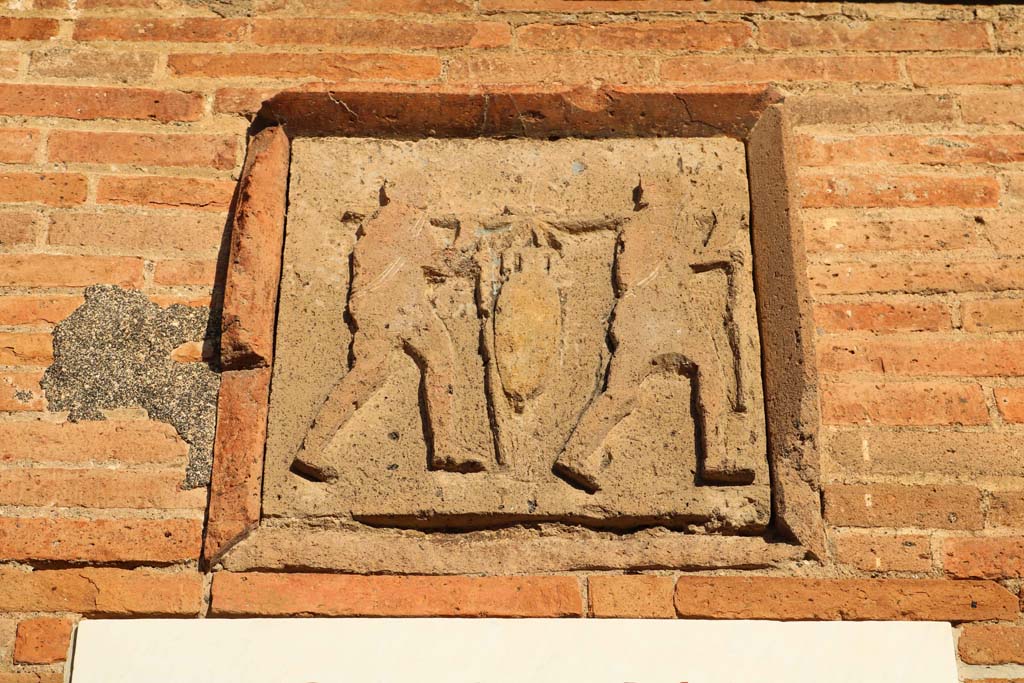 VII.4.16 Pompeii. December 2018. Plaque on west corner pilaster. Photo courtesy of Aude Durand.