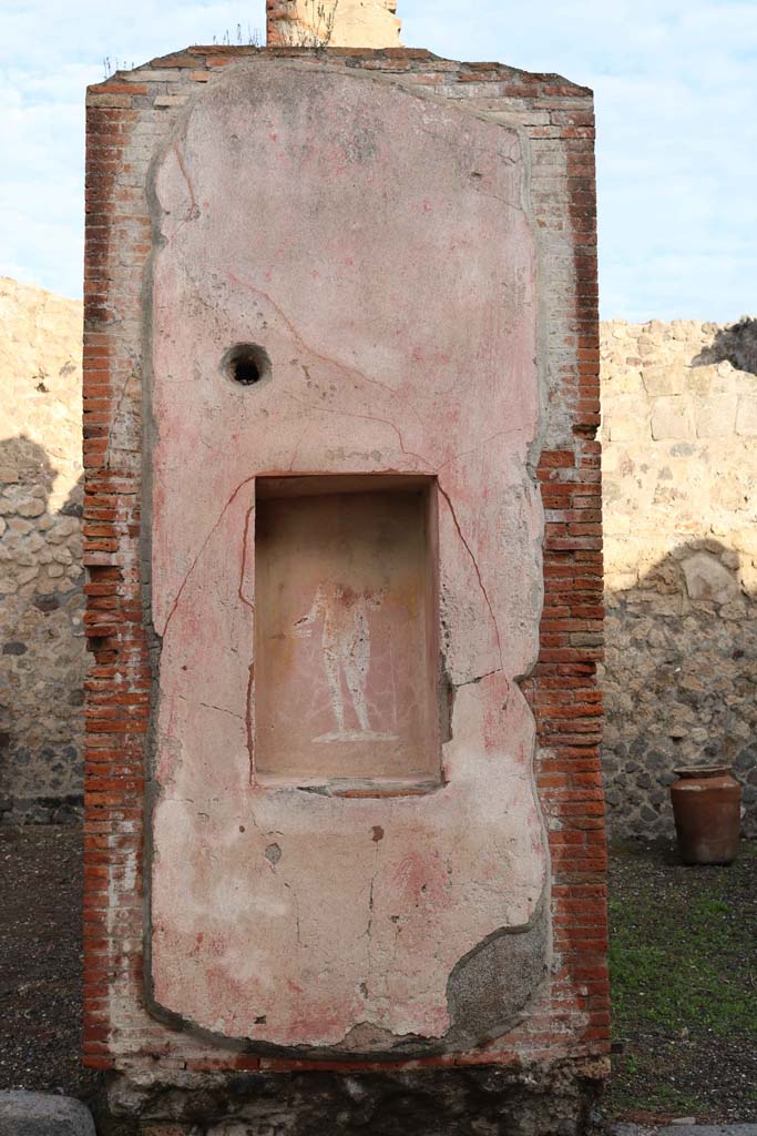 VII.4.16 Pompeii. December 2018. 
Pilaster between VII.4.16, on left and VII.4.17, with street altar showing a painting of Jupiter, see also VII.4.17.
Photo courtesy of Aude Durand.
