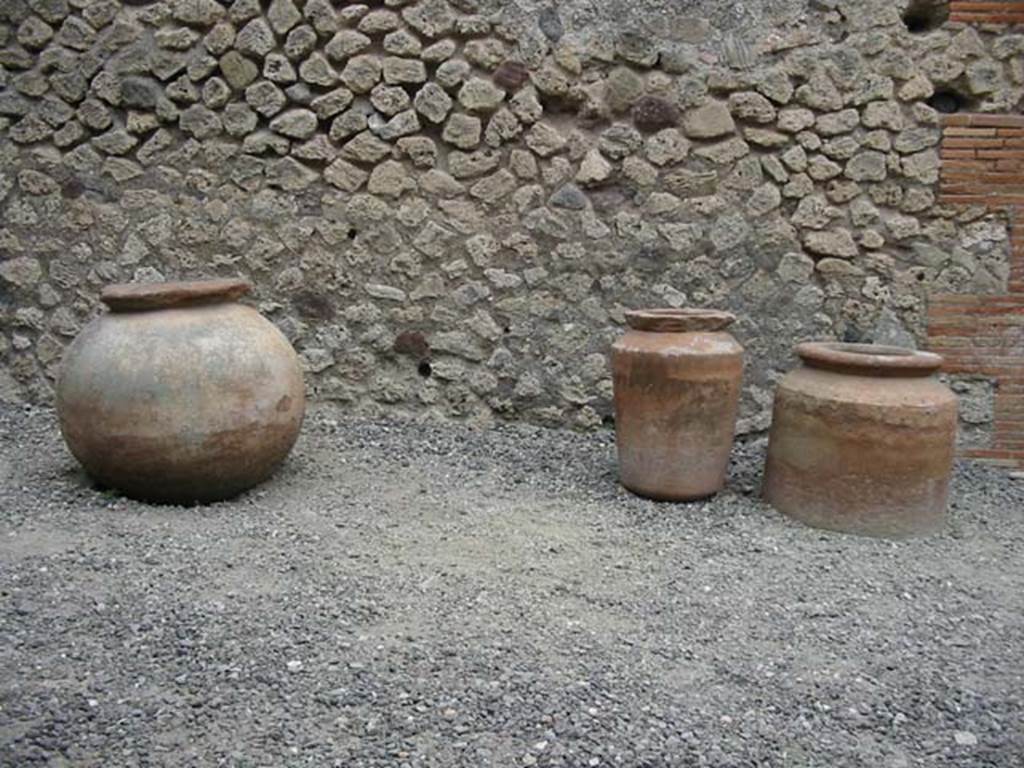 VII.4.17 Pompeii.  May 2003. Terracotta pots near east wall. Photo courtesy of Nicolas Monteix.