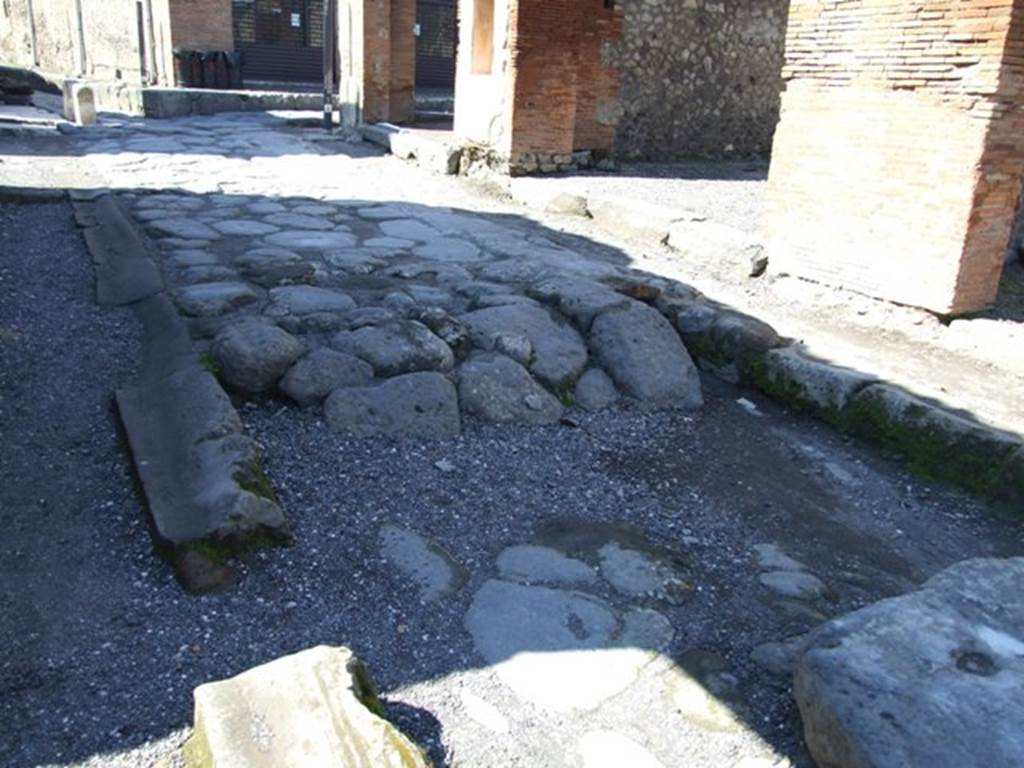 VII.4.18 Pompeii. March 2009.  Via degli Augustali looking west towards junction with Via del Foro.  Road surface outside shop.