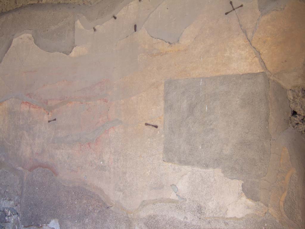 VII.4.25 Pompeii. September 2005. East wall of shop, remains of painting.