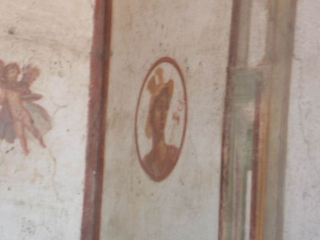 VII.4.48 Pompeii, December 2007. Room 14, cubiculum. North wall, west end. Medallion painting of Hermes or Mercurius.


