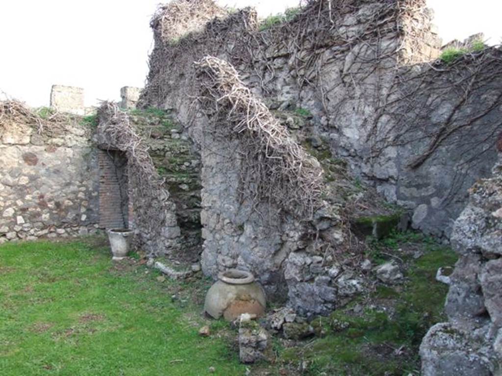 VII.4.58 Pompeii. December 2007. 
South wall with two rear staircases. On the right, three steps leading to a landing, then seven steps leading to the upper floor.  
