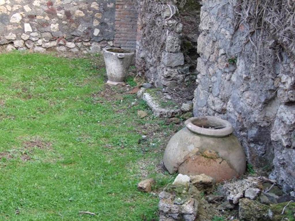 VII.4.58 Pompeii. December 2007. Pot and dolium near two rear staircases.   