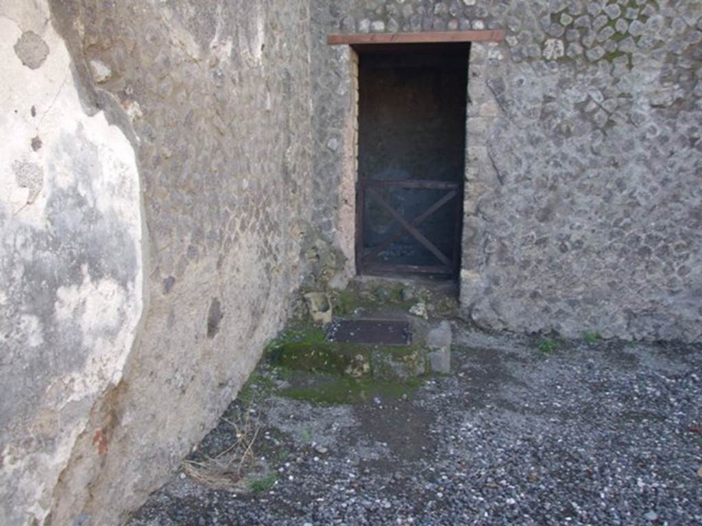 VII.5.23 Pompeii. December 2007. Door to rear room of shop.