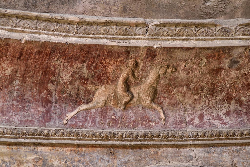VII.5.24 Pompeii. April 2018. Detail of cupid on horse-back from stucco cornice on south side.  
Photo courtesy of Ian Lycett-King. Use is subject to Creative Commons Attribution-NonCommercial License v.4 International.

