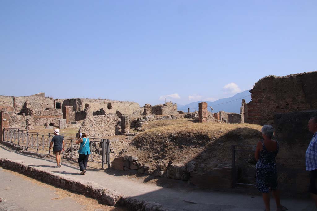 VII.6.1, Pompeii, doorway on right. September 2019. 
Looking south-east across VII.6 on south side of Via delle Terme, from junction with Vicolo del Farmacista, on right.
Photo courtesy of Klaus Heese.
