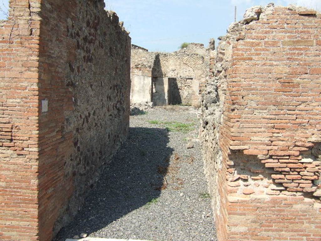 VII.6.30 Pompeii. September 2005. Looking north from entrance doorway. According to Spano in NdS,  a staircase made of masonry and lava-stone would have been on the right shortly after the entrance doorway. Also on the right was a small latrine. See Spano in Notizie degli Scavi, 1910, p.481.

By 1873 only the entrance and fauces or entrance corridor had been excavated, according to Fiorelli. See Pappalardo, U., 2001. La Descrizione di Pompei per Giuseppe Fiorelli (1875). Napoli: Massa Editore. (p.160)
According to Della Corte, he surmised that Petutio Quintioni  would have been the dweller in this house, judging by an amphora found in the atrium. This amphora was addressed to Petutio Quintioni, and had been sent from Pompeius Onesimus. See Della Corte, M., 1965.  Case ed Abitanti di Pompei. Napoli: Fausto Fiorentino. (p.172)

