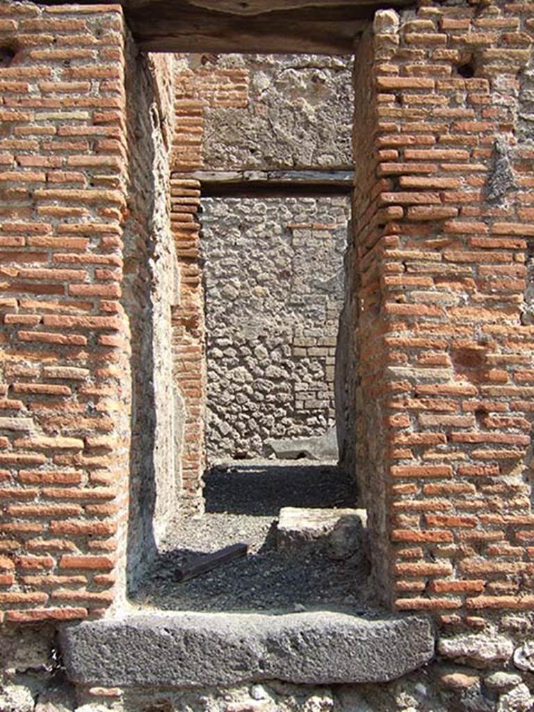 VII.6.30 Pompeii. September 2005. Looking east along corridor from rear entrance at VII.6.37. The doorway on the south of the corridor, lit by the sun, would have led to the latrine. According to Spano, this corridor, would have been numbered “156”.
On the right of this in room “155” would have been a latrine, in which were preserved remains of painted decoration. (In a note he said that the latrines in some other houses were also decorated with painted walls, for example V.5.i The House of the Silver Wedding, and VI.9.6 The House of Castor and Pollux (also known as the Casa dei Dioscuri).
See Spano in Notizie degli Scavi, 1910, (p.484 and note).

